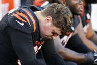 Trey Hendrickson looks down while sitting on the bench - Source: Imagn